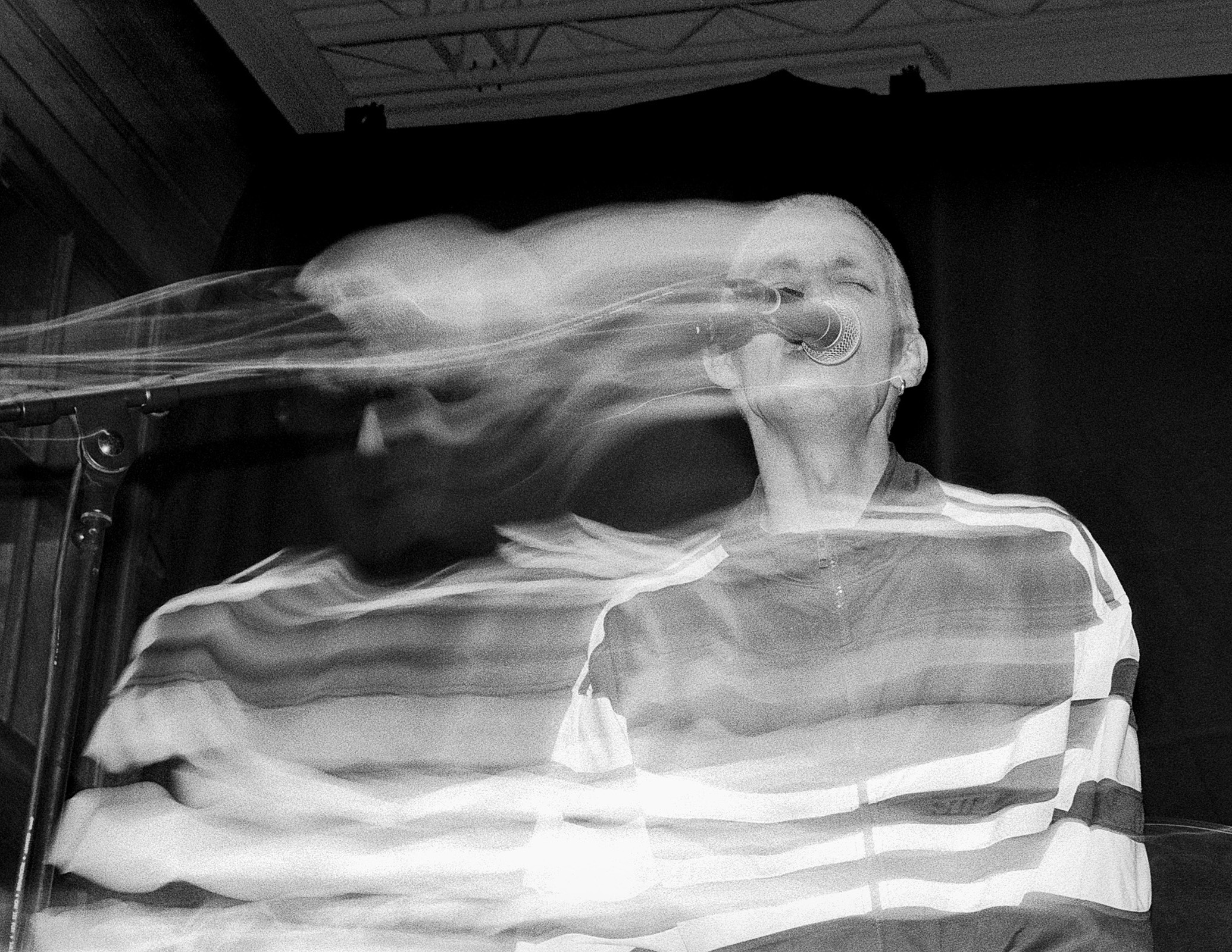 A portrait of Gustaf Rasch on stage with motion blur