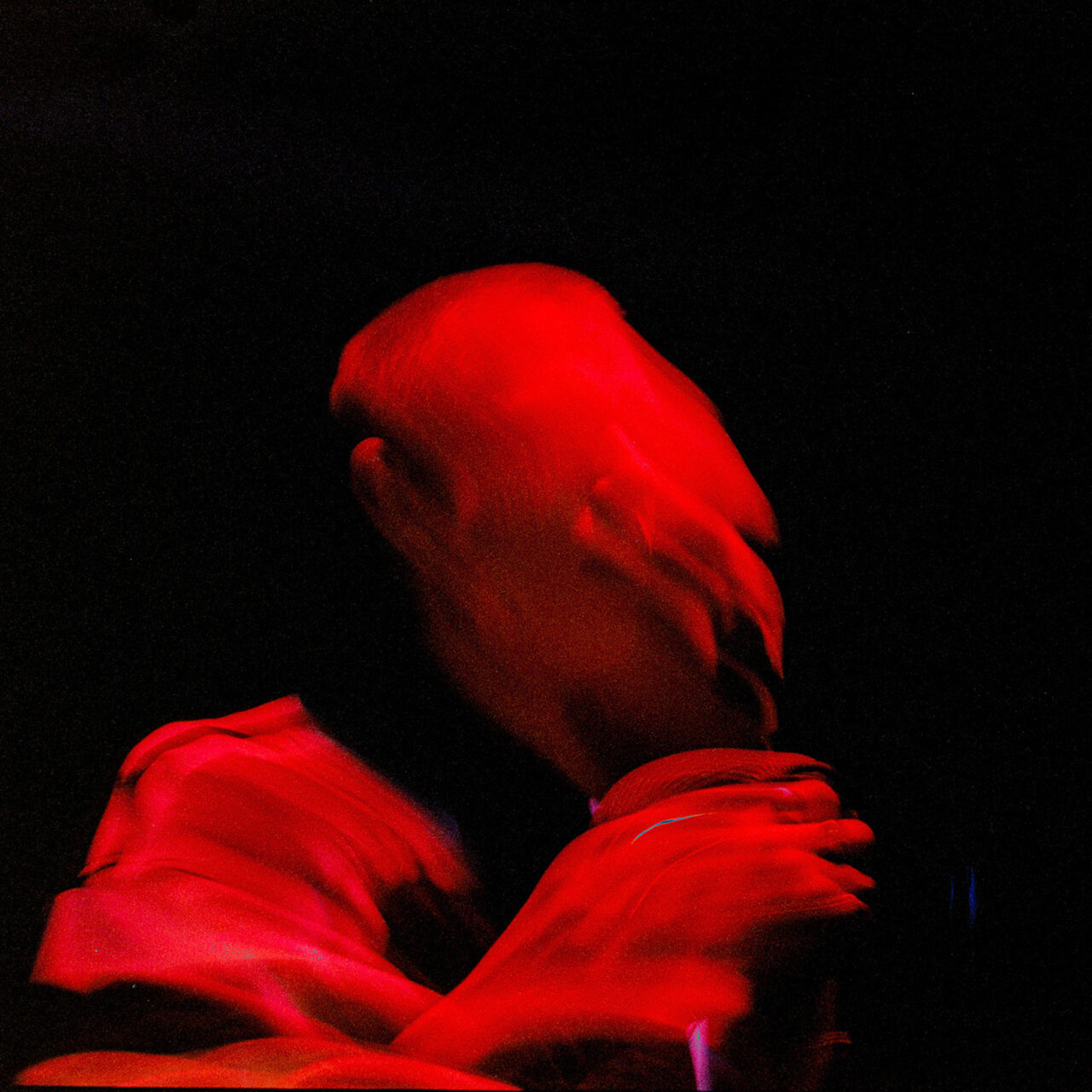 A red blurry image of Gustaf Rasch